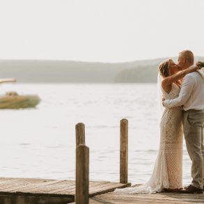 wedding couple kiss on the dock
